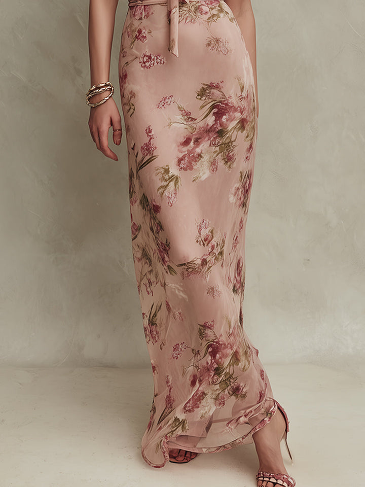 Lia - Élégante robe longue en mousseline à imprimé floral et encolure ajourée