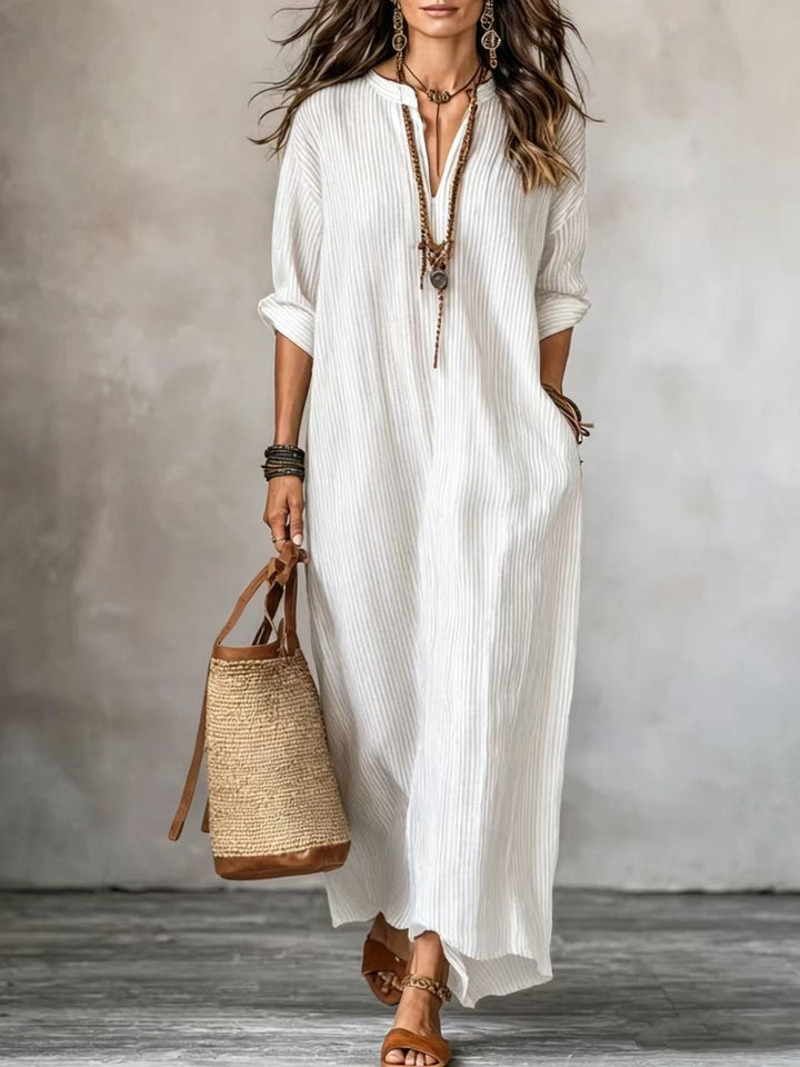 HAVEN | Robe longue élégante à rayures avec col en V, manches longues et poches latérales pratiques