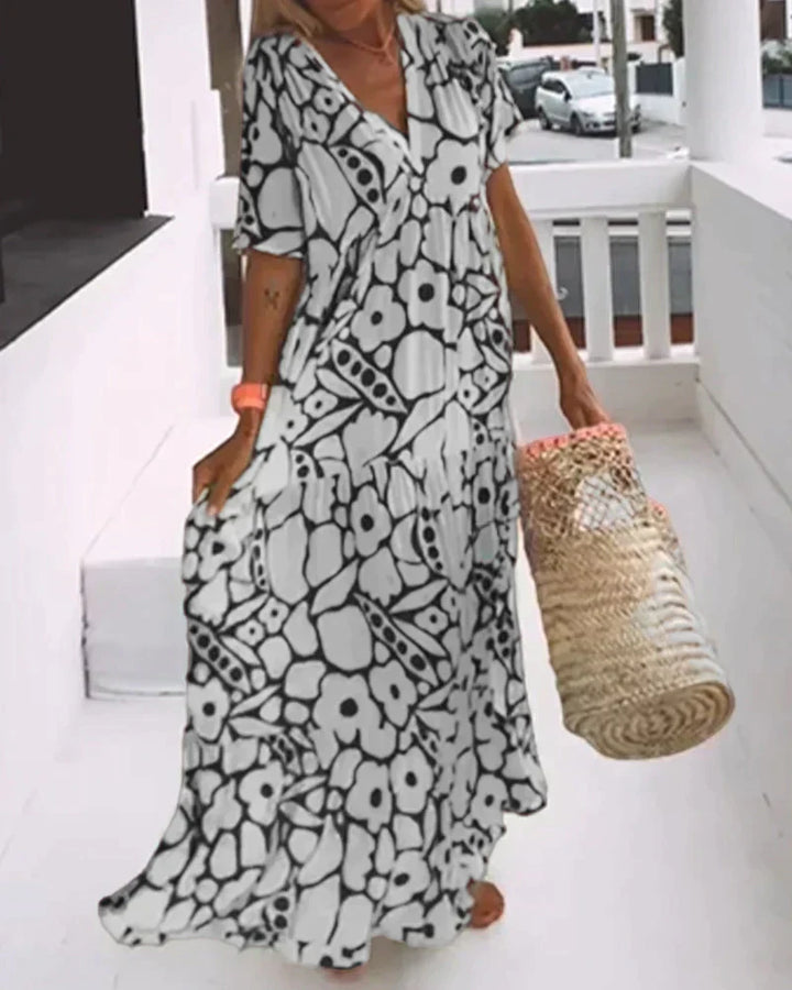 CHRISTINE | Élégante robe d’été longue à la silhouette fluide et au motif graphique tendance