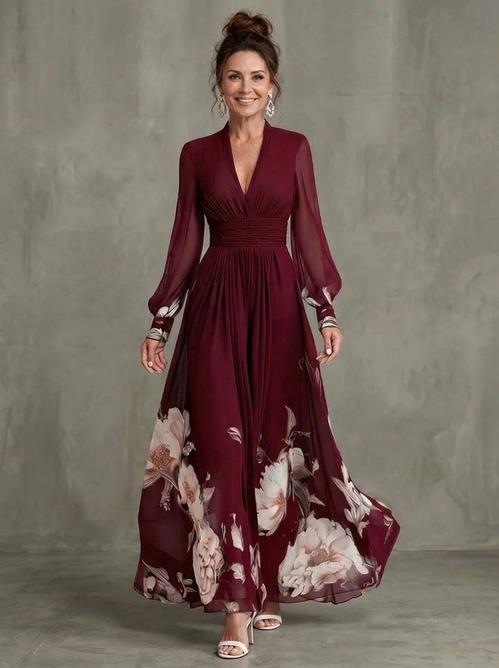 Robe longue fleurie Maude™ avec manches transparentes et détail d’ourlet élégant